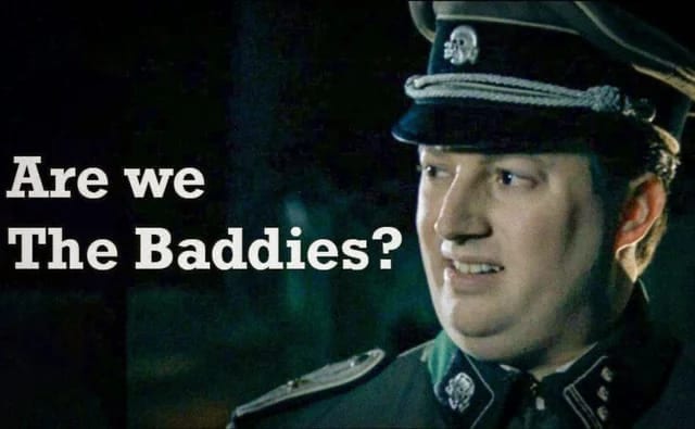 A Nazi officer from the Mitchell and Webb sketch, captioned "Are we The Baddies?"